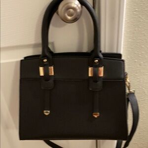 Elegant Black Handbag with Gold Accents & Shoulder Strap